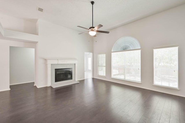 7405 Mesa Verde Trl, Fort Worth, TX 76137 - unfurnished living room with dark wood finished floors, a ceiling fan, and a glass covered fireplace