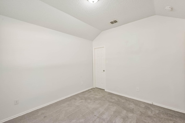 7405 Mesa Verde Trl, Fort Worth, TX 76137 - unfurnished room featuring vaulted ceiling, a smoke detector, carpet floors, and baseboards