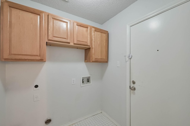 7405 Mesa Verde Trl, Fort Worth, TX 76137 - laundry room with hookup for a washing machine, electric dryer hookup, cabinet space, baseboards, and a textured ceiling