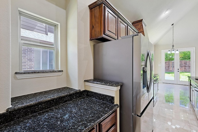 205 Hogue Ln, Wylie, TX 75098 - kitchen with stainless steel fridge with ice dispenser, french doors, dark stone countertops, lofted ceiling, and pendant lighting