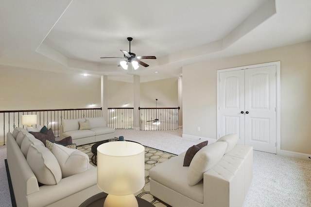 205 Hogue Ln, Wylie, TX 75098 - living area featuring ceiling fan, light carpet, a tray ceiling, and baseboards