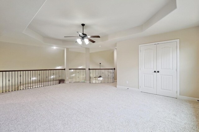 205 Hogue Ln, Wylie, TX 75098 - spare room featuring a ceiling fan, carpet floors, a raised ceiling, and baseboards