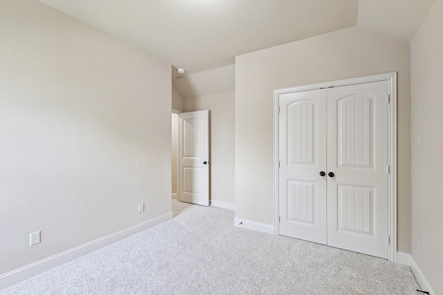 205 Hogue Ln, Wylie, TX 75098 - unfurnished bedroom featuring carpet floors, a closet, baseboards, and vaulted ceiling