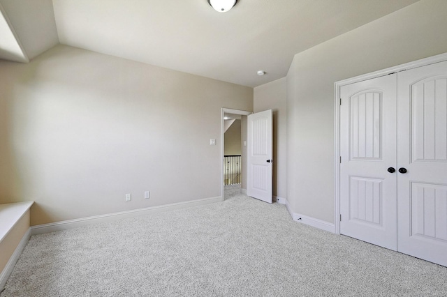 205 Hogue Ln, Wylie, TX 75098 - unfurnished bedroom with carpet floors, a closet, vaulted ceiling, and baseboards
