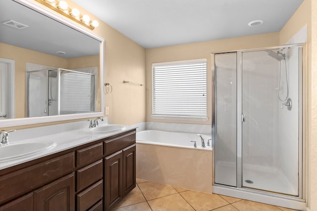 12001 Walden Wood Dr, Fort Worth, TX 76244 - full bath with double vanity, a garden tub, a shower stall, and tile patterned flooring