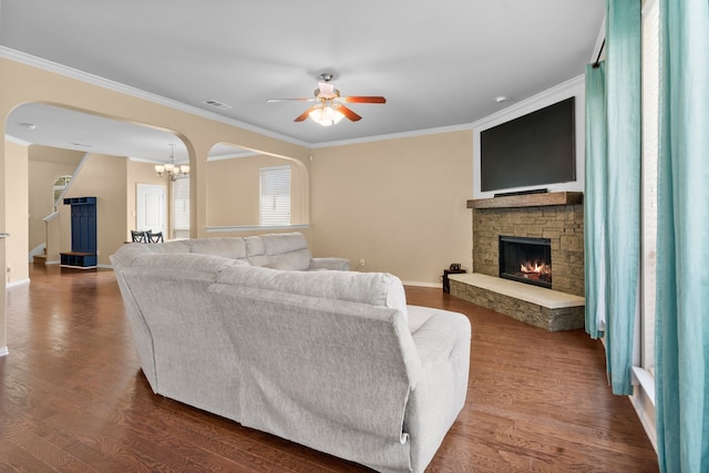 12001 Walden Wood Dr, Fort Worth, TX 76244 - living area featuring arched walkways, ceiling fan, a stone fireplace, crown molding, and dark wood-style flooring