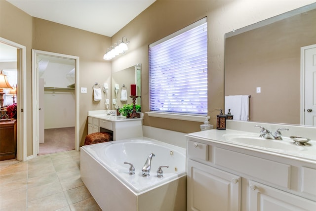 3801 Emerald Park Dr, Corinth, TX 76208 - bathroom with vanity, a whirlpool tub, a walk in closet, and tile patterned flooring