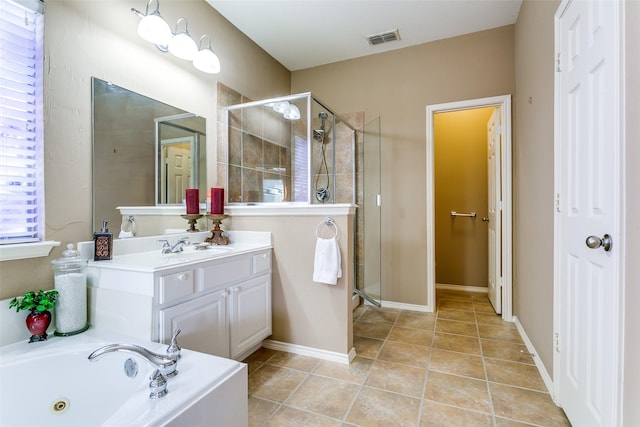 3801 Emerald Park Dr, Corinth, TX 76208 - full bath with a stall shower, vanity, tile patterned flooring, and a jetted tub