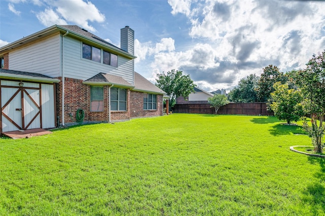 3801 Emerald Park Dr, Corinth, TX 76208 - back of house featuring a chimney and brick siding