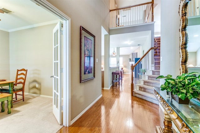 3801 Emerald Park Dr, Corinth, TX 76208 - foyer featuring stairway, baseboards, hardwood / wood-style floors, and crown molding