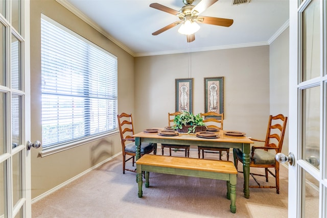 3801 Emerald Park Dr, Corinth, TX 76208 - carpeted dining room featuring french doors, baseboards, crown molding, and a ceiling fan