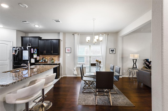 10313 Dimmit Pl, Mckinney, TX 75071 - dining room featuring a chandelier, dark wood-style floors, baseboards, recessed lighting, and bar area