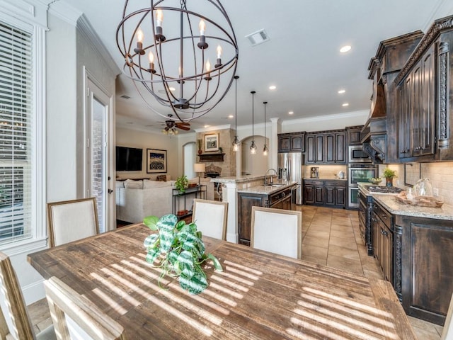 1221 Morris Dr, Keller, TX 76248 - dining space with a chandelier, recessed lighting, ornamental molding, and light tile patterned floors