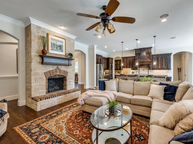 1221 Morris Dr, Keller, TX 76248 - living room featuring arched walkways, a ceiling fan, baseboards, recessed lighting, and dark wood-type flooring