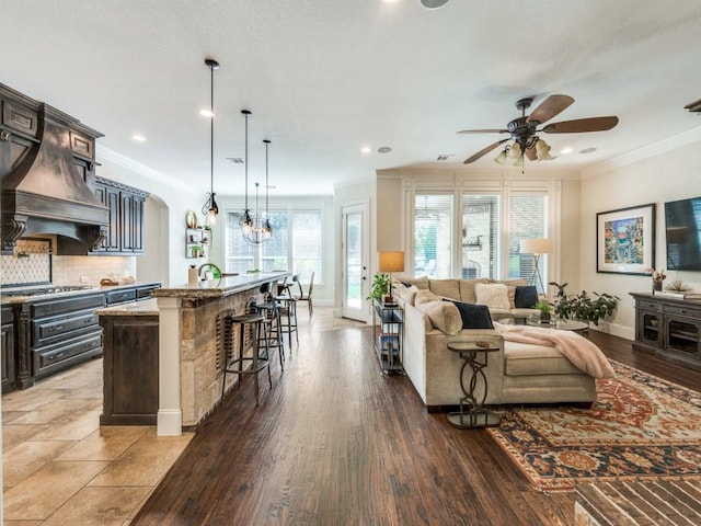 1221 Morris Dr, Keller, TX 76248 - living room featuring a ceiling fan, ornamental molding, wood finished floors, baseboards, and recessed lighting