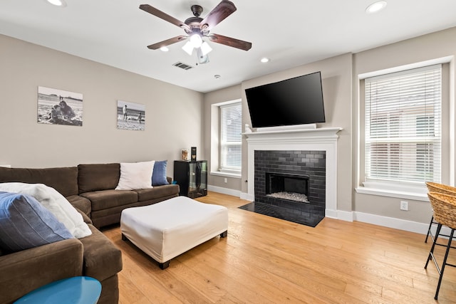 2600 Shadow Hill Ln, Plano, TX 75093 - living room with a ceiling fan, light wood-style flooring, baseboards, recessed lighting, and a fireplace with flush hearth