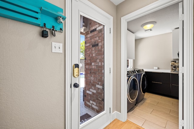 2600 Shadow Hill Ln, Plano, TX 75093 - laundry area featuring washing machine and dryer and light wood-style flooring