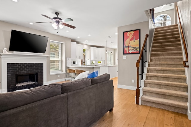 2600 Shadow Hill Ln, Plano, TX 75093 - living room with baseboards, stairway, a ceiling fan, light wood finished floors, and recessed lighting