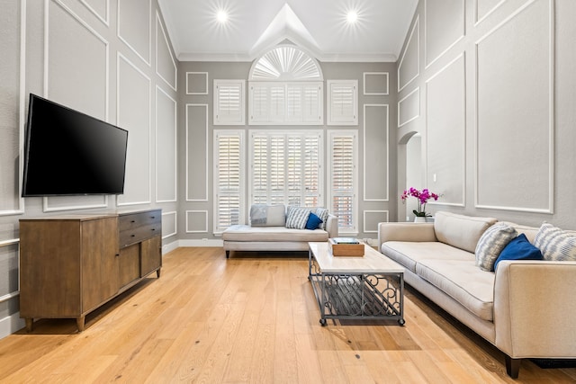 2600 Shadow Hill Ln, Plano, TX 75093 - living room with a decorative wall, crown molding, light wood-type flooring, a high ceiling, and recessed lighting