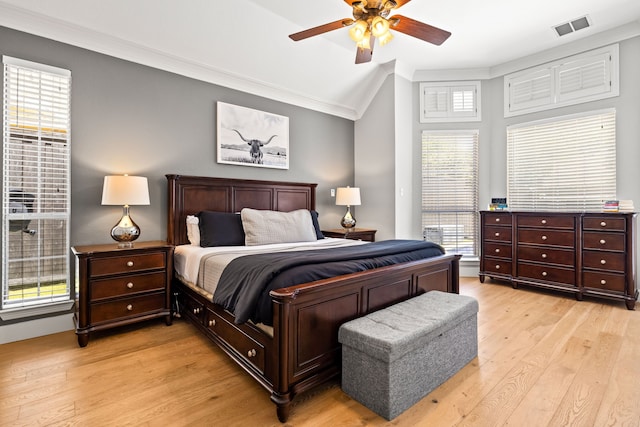 2600 Shadow Hill Ln, Plano, TX 75093 - bedroom featuring crown molding, light wood finished floors, multiple windows, vaulted ceiling, and ceiling fan