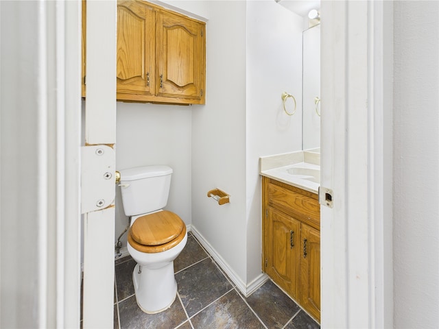1120 Canyon Ridge Dr, Desoto, TX 75115 - half bathroom with vanity, toilet, and baseboards