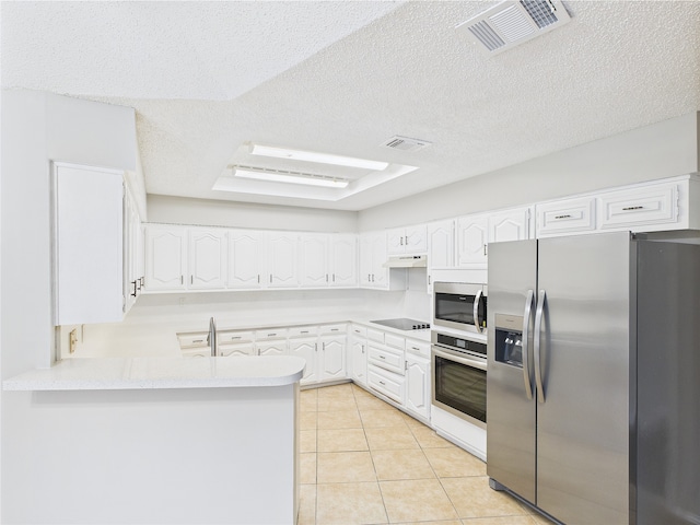 1120 Canyon Ridge Dr, Desoto, TX 75115 - kitchen with stainless steel appliances, a peninsula, white cabinets, light countertops, and light tile patterned floors