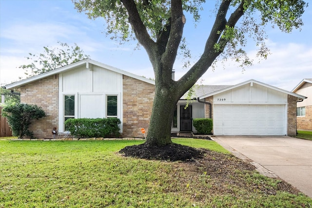 7209 W Cleburne Rd, Fort Worth, TX 76133 - mid-century home with brick siding, an attached garage, concrete driveway, and a front yard