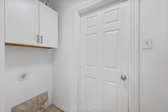 7209 W Cleburne Rd, Fort Worth, TX 76133 - laundry area featuring electric dryer hookup and cabinet space