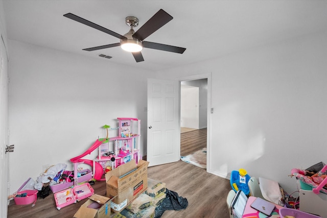 7209 W Cleburne Rd, Fort Worth, TX 76133 - rec room with wood finished floors, ceiling fan, and baseboards
