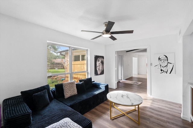 7209 W Cleburne Rd, Fort Worth, TX 76133 - living room featuring wood finished floors, a ceiling fan, and baseboards
