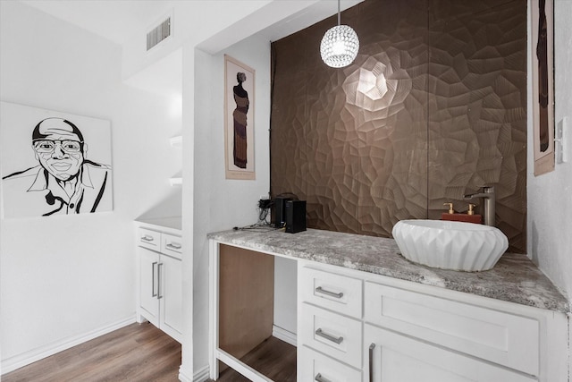 7209 W Cleburne Rd, Fort Worth, TX 76133 - bathroom with vanity, wood finished floors, and baseboards