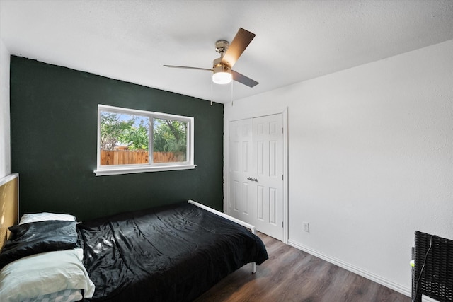 7209 W Cleburne Rd, Fort Worth, TX 76133 - bedroom featuring wood finished floors, a closet, baseboards, and ceiling fan