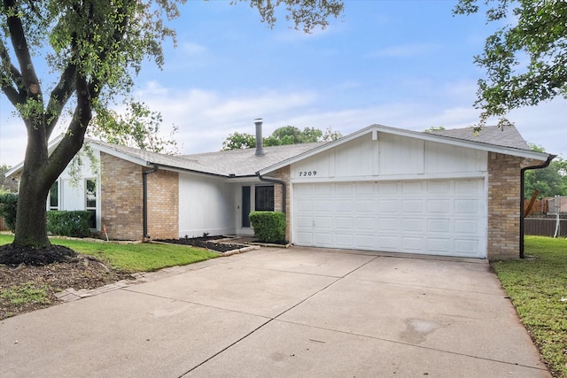 7209 W Cleburne Rd, Fort Worth, TX 76133 - view of front facade with concrete driveway, a garage, and brick siding