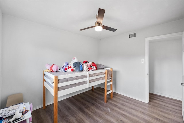 7209 W Cleburne Rd, Fort Worth, TX 76133 - bedroom featuring wood finished floors, baseboards, and a ceiling fan
