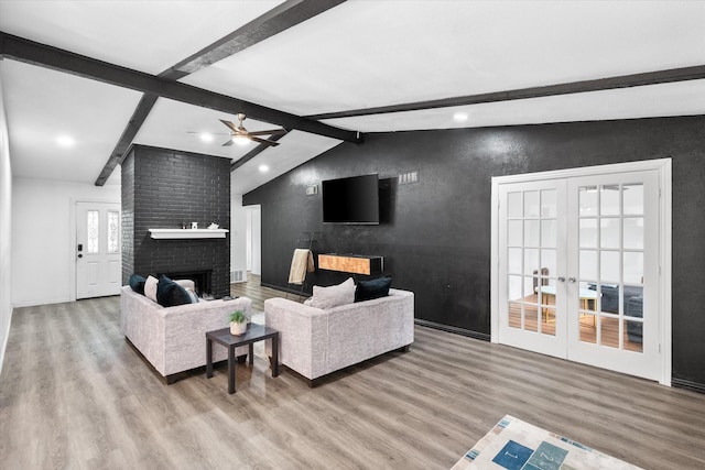 7209 W Cleburne Rd, Fort Worth, TX 76133 - living area featuring wood finished floors, a ceiling fan, a brick fireplace, french doors, and recessed lighting