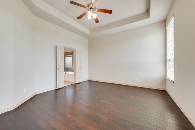 9641 Calaveras Rd, Fort Worth, TX 76177 - unfurnished room with ceiling fan, a tray ceiling, healthy amount of natural light, and dark wood-style floors