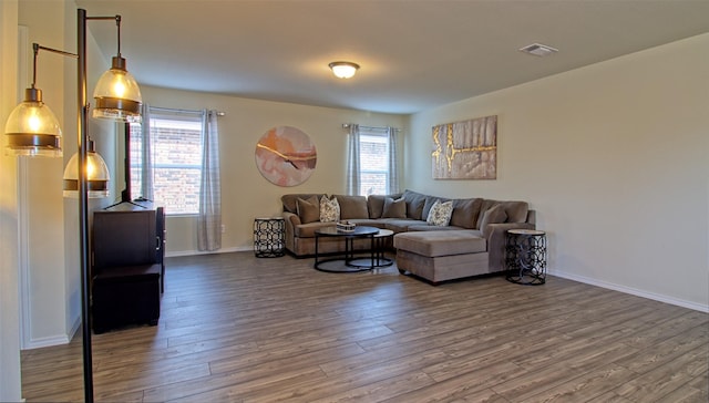 1438 Ganado Dr, Forney, TX 75126 - living area featuring wood finished floors and baseboards