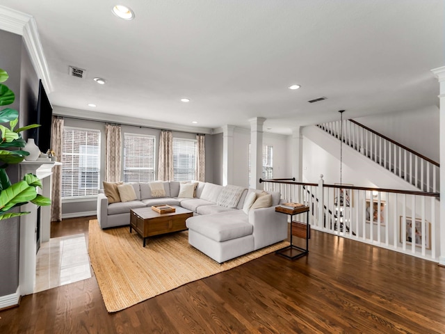 2917 Hallsville St, Dallas, TX 75204 - living room featuring decorative columns, wood finished floors, recessed lighting, and baseboards