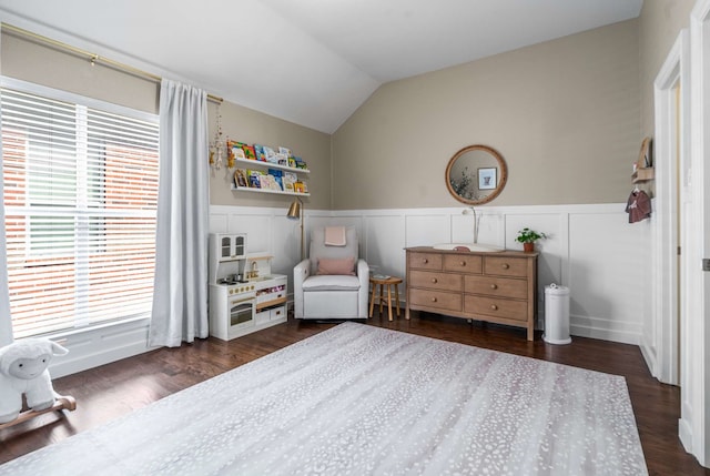 2917 Hallsville St, Dallas, TX 75204 - sitting room featuring healthy amount of natural light, wainscoting, lofted ceiling, dark wood-type flooring, and a decorative wall