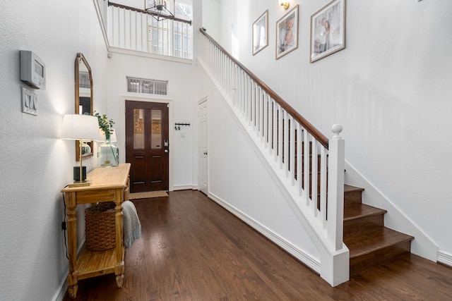 2917 Hallsville St, Dallas, TX 75204 - foyer entrance with dark wood-style floors, stairs, baseboards, and a towering ceiling