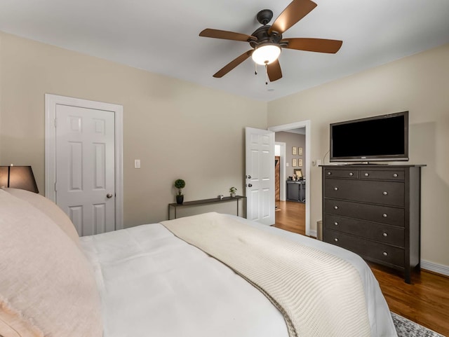 2917 Hallsville St, Dallas, TX 75204 - bedroom featuring wood finished floors, ceiling fan, and baseboards