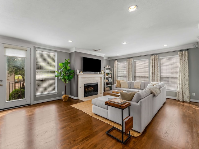 2917 Hallsville St, Dallas, TX 75204 - living room with a fireplace with flush hearth, ornamental molding, wood finished floors, baseboards, and recessed lighting