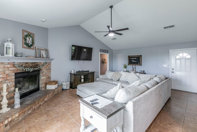 4260 Gun Club Rd, Temple, TX 76501 - living room with ceiling fan, tile patterned floors, lofted ceiling, and a brick fireplace
