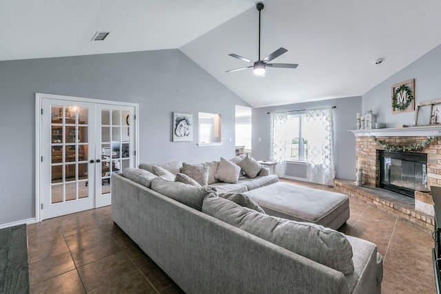 4260 Gun Club Rd, Temple, TX 76501 - tiled living room with a ceiling fan, a fireplace, french doors, and high vaulted ceiling