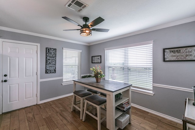 4260 Gun Club Rd, Temple, TX 76501 - dining area featuring dark wood-style flooring, a ceiling fan, baseboards, and ornamental molding