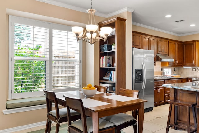 3601 Whitehaven Dr, Plano, TX 75093 - dining room with a chandelier, crown molding, light tile patterned floors, and recessed lighting