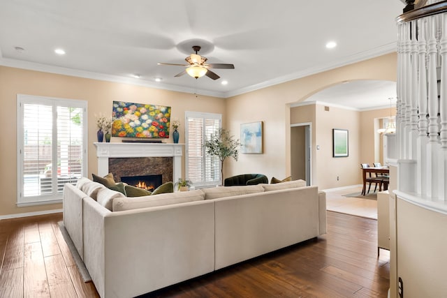 3601 Whitehaven Dr, Plano, TX 75093 - living area featuring arched walkways, ceiling fan, a premium fireplace, plenty of natural light, and recessed lighting