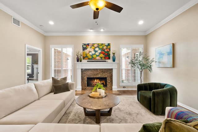 3601 Whitehaven Dr, Plano, TX 75093 - living room featuring ceiling fan, wood finished floors, recessed lighting, ornamental molding, and a high end fireplace