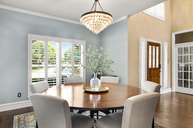 3601 Whitehaven Dr, Plano, TX 75093 - dining area with a chandelier, hardwood / wood-style flooring, baseboards, and ornamental molding