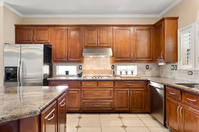 3601 Whitehaven Dr, Plano, TX 75093 - kitchen featuring appliances with stainless steel finishes, range hood, dark stone countertops, light tile patterned floors, and tasteful backsplash